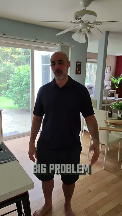 Homeowner in his remodeled living space sharing his experience